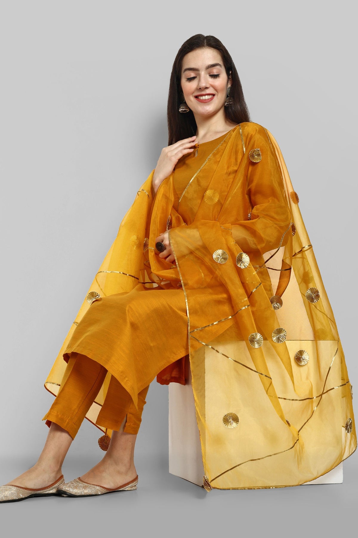 Mustard key hole boat neck kurta paired with elasticated pants and an organza dupatta - a stylish set of three for a sophisticated and coordinated look