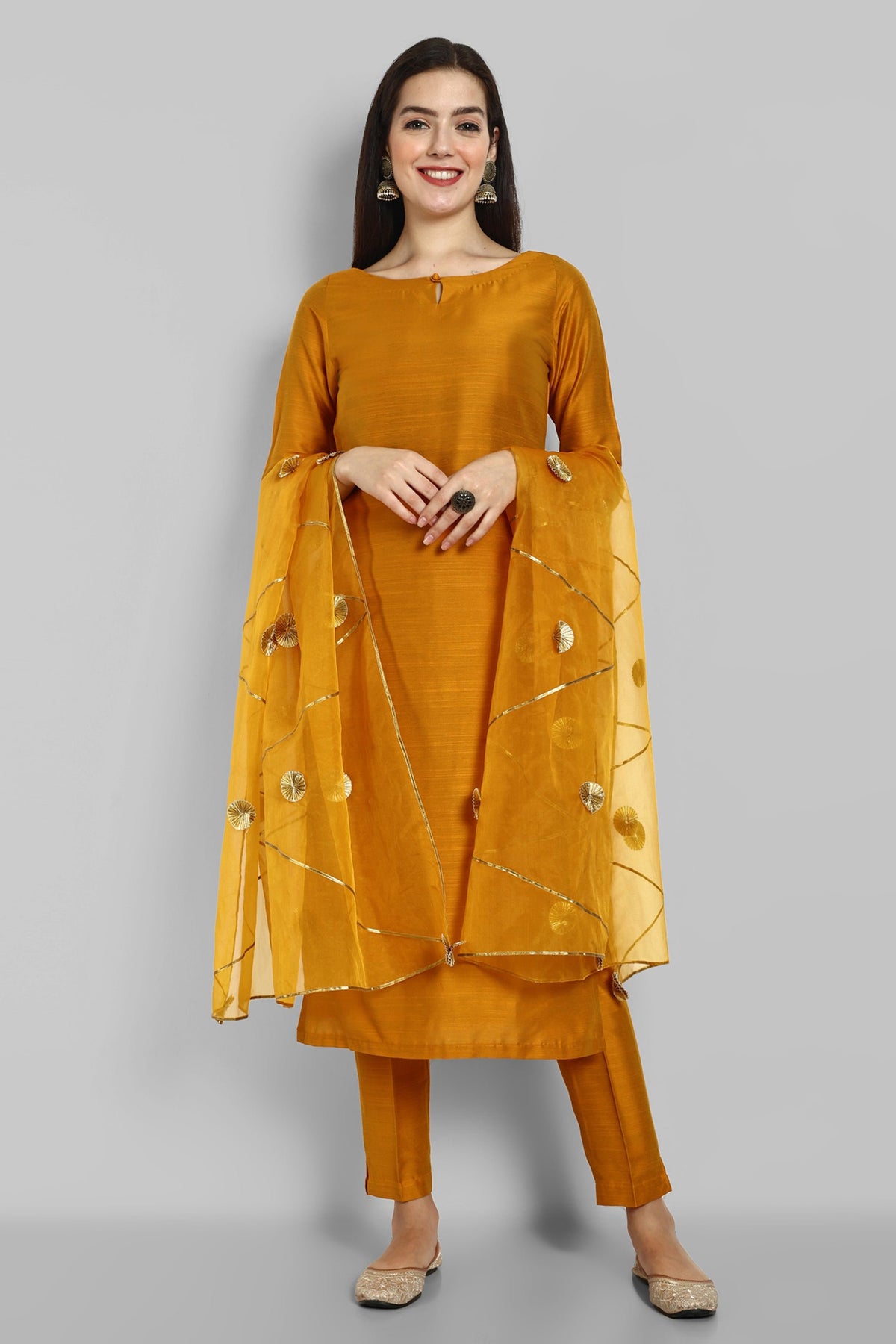 Mustard key hole boat neck kurta paired with elasticated pants and an organza dupatta - a stylish set of three for a sophisticated and coordinated look